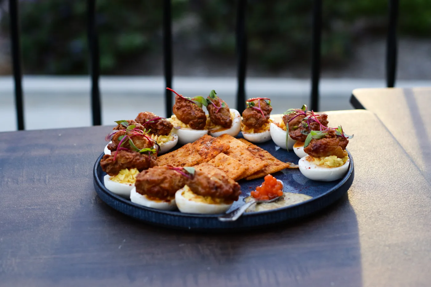 Deviled egg platter with crispy bites and salmon roe